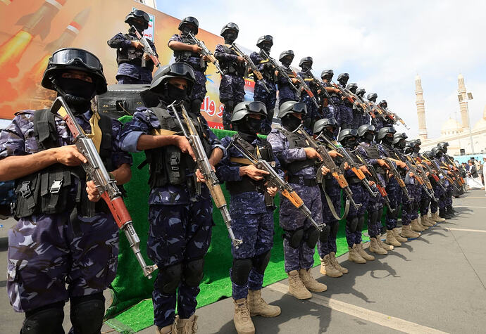 Houthi troops standing guard in July in San'a, Yemen.